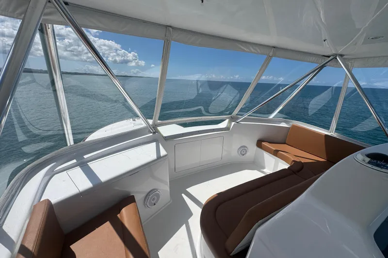  Yacht Photos Pics Interior view of 2002 Viking 55 Convertible yacht with ocean backdrop.