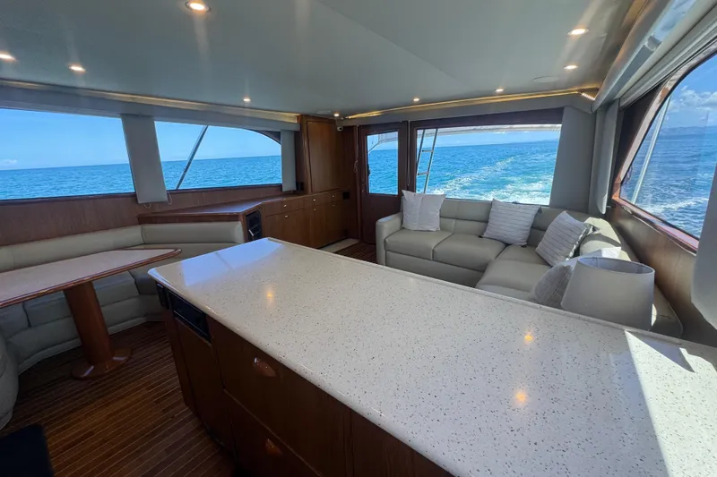  Yacht Photos Pics Luxurious interior of 2002 Viking 55 Convertible yacht with ocean view.