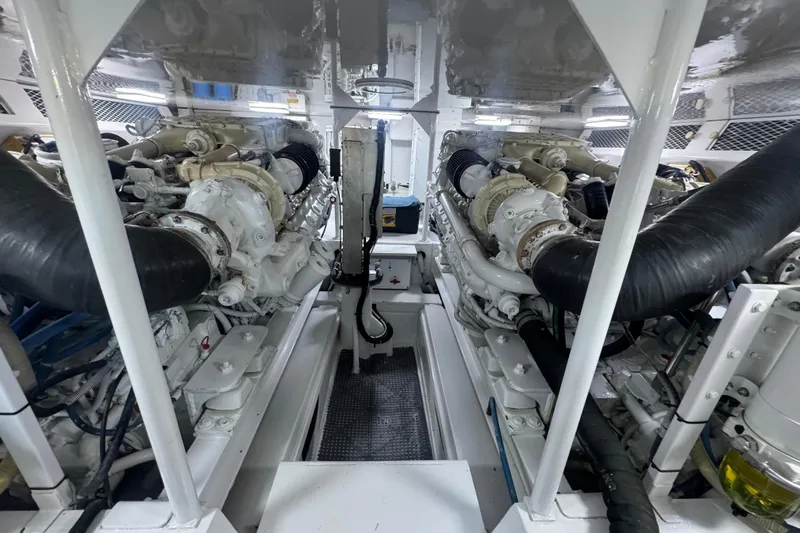  Yacht Photos Pics Engine room of a 2002 Viking 55 Convertible yacht, showcasing dual engines.