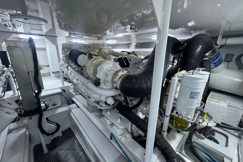  Yacht Photos Pics Engine room of a 2002 Viking 55 Convertible yacht, showcasing machinery and components.