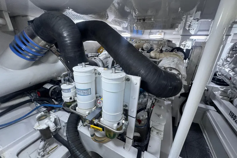  Yacht Photos Pics Engine room of 2002 Viking 55 Convertible yacht, showcasing complex machinery and components.