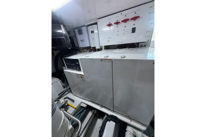  Yacht Photos Pics Engine room of 2002 Viking 55 Convertible yacht with control panels and equipment.