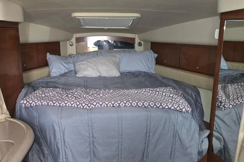  Yacht Photos Pics Cozy cabin interior of 2007 Sea Ray 340 Sundancer with comfortable bedding.