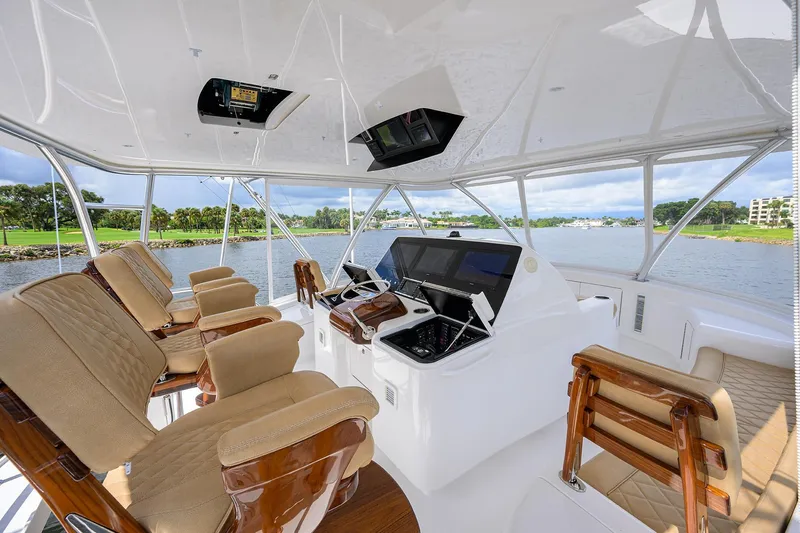 Hmy Trade Yacht Photos Pics 2023 Viking 64 Convertible Flybrdige Helm Seating and Electronics