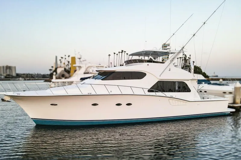 Ok'd By Dad Yacht Photos Pics 2001 Mikelson 61 Yachtfisher in marina, sleek design, calm water backdrop.
