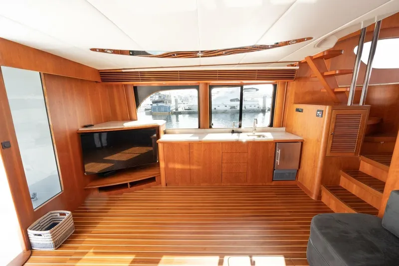 Ok'd By Dad Yacht Photos Pics Luxurious interior of 2001 Mikelson 61 Yachtfisher with wood finish and modern amenities.