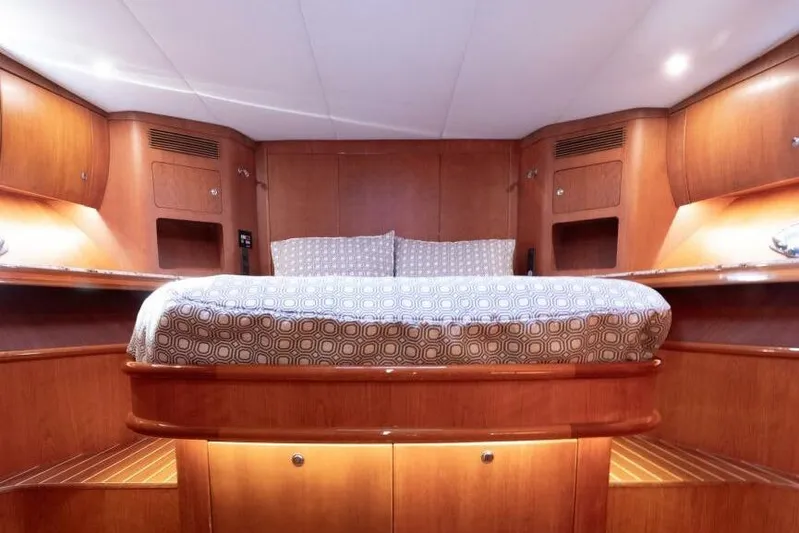 Ok'd By Dad Yacht Photos Pics Luxurious cabin interior of 2001 Mikelson 61 Yachtfisher with elegant wood finish.