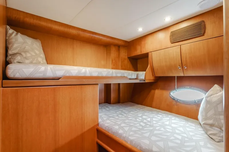Ok'd By Dad Yacht Photos Pics Interior of 2001 Mikelson 61 Yachtfisher with wooden bunk beds and modern lighting.