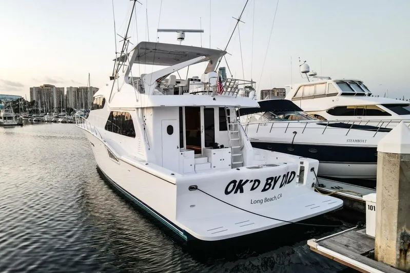 Ok'd By Dad Yacht Photos Pics 2001 Mikelson 61 Yachtfisher docked in Long Beach marina at sunset.