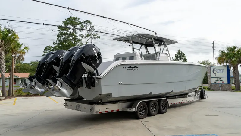  Yacht Photos Pics 2021 Invincible 37 Catamaran on trailer with triple outboard engines.