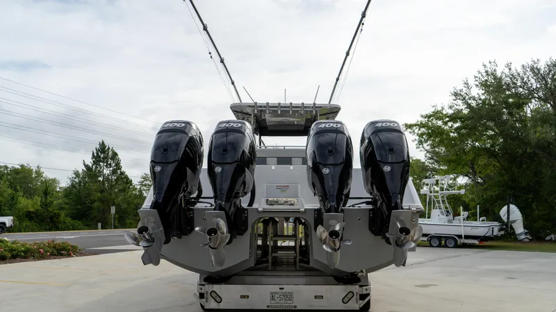  Yacht Photos Pics 2021 Invincible 37 Catamaran with four powerful outboard engines, rear view.