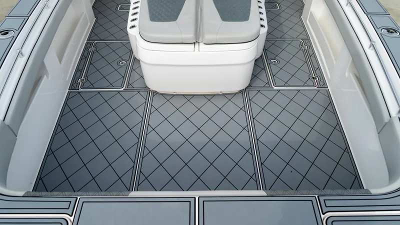  Yacht Photos Pics 2021 Invincible 37 Catamaran interior with diamond-patterned flooring and seating.