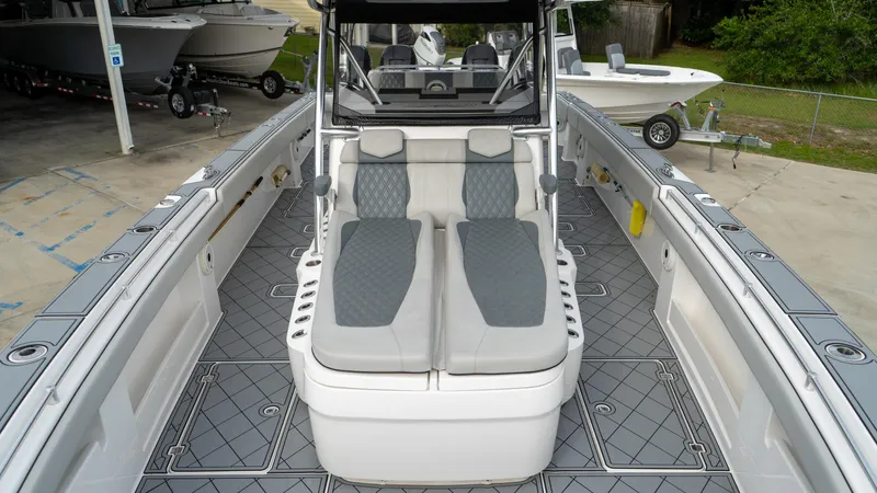  Yacht Photos Pics 2021 Invincible 37 Catamaran interior with gray seating and spacious deck layout.