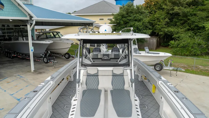  Yacht Photos Pics 2021 Invincible 37 Catamaran docked, showcasing spacious deck and modern design.