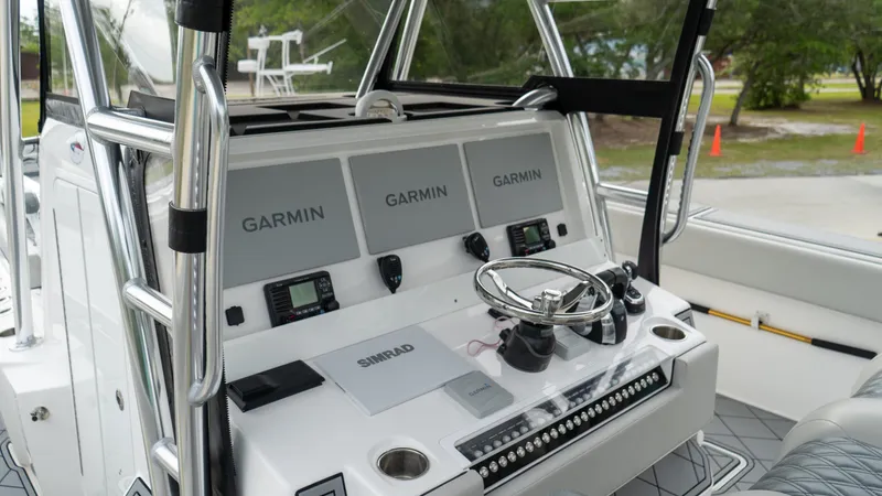 Yacht Photos Pics Invincible 37 Catamaran 2021 dashboard with Garmin navigation systems and steering wheel.