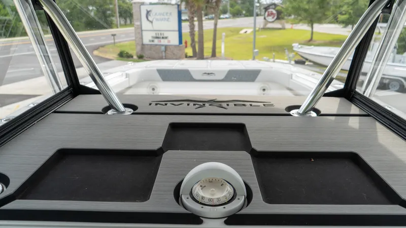  Yacht Photos Pics 2021 Invincible 37 Catamaran dashboard with compass, viewed from the interior.