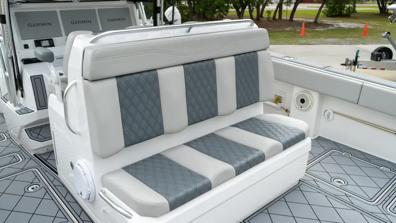  Yacht Photos Pics Luxury seating on 2021 Invincible 37 Catamaran with diamond-pattern upholstery.