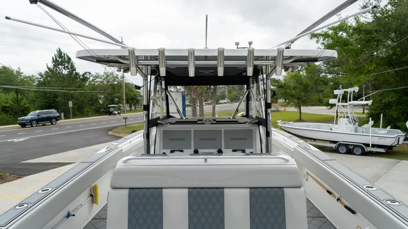  Yacht Photos Pics 2021 Invincible 37 Catamaran with advanced navigation systems, docked on a trailer.