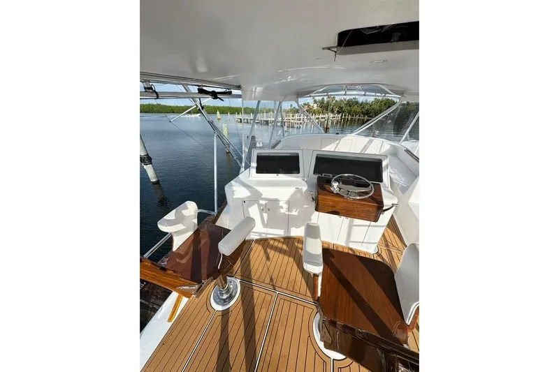 Sea Hag Yacht Photos Pics Luxurious 2008 Blackwell Custom Carolina 61 yacht helm with polished wood and modern controls.