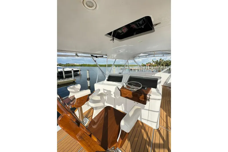 Sea Hag Yacht Photos Pics 2008 Blackwell Custom Carolina 61 yacht helm with wooden chairs and scenic marina view.