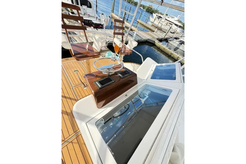 Sea Hag Yacht Photos Pics 2008 Blackwell Custom Carolina 61 yacht with polished wood helm and marina view.