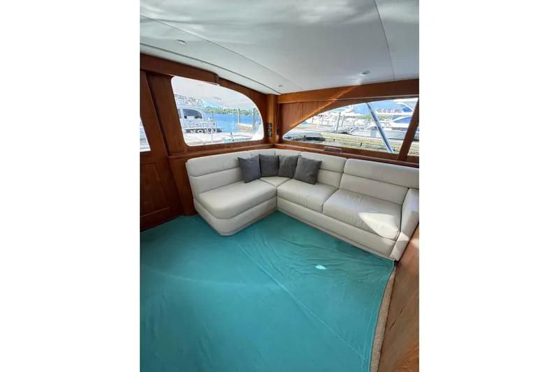 Sea Hag Yacht Photos Pics Luxurious interior of 2008 Blackwell Custom Carolina 61 yacht with plush seating and scenic windows.