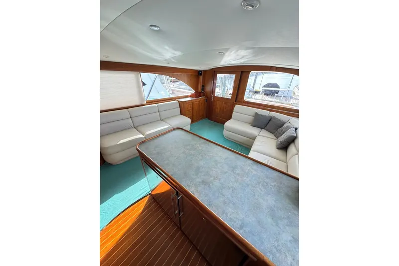 Sea Hag Yacht Photos Pics Luxurious interior of 2008 Blackwell Custom Carolina 61 yacht with elegant seating and wood finishes.
