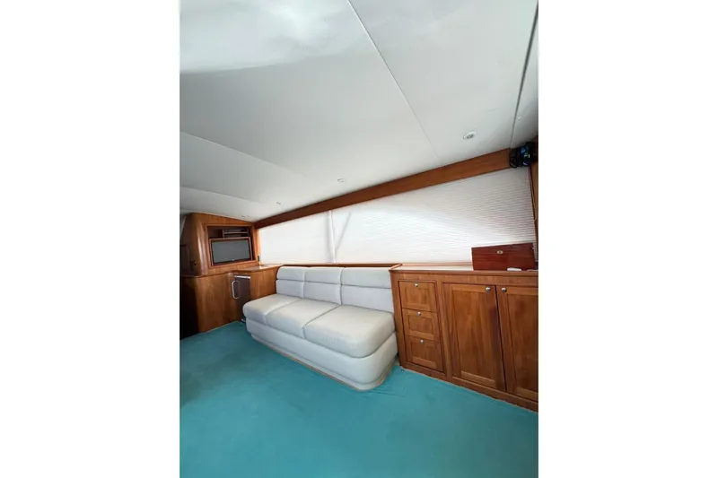 Sea Hag Yacht Photos Pics Luxurious interior of 2008 Blackwell Custom Carolina 61 yacht with elegant wood cabinetry and plush seating.