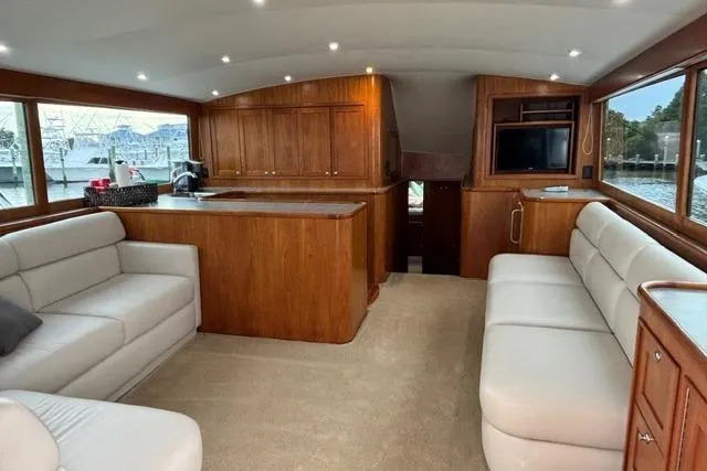 Sea Hag Yacht Photos Pics Luxurious interior of 2008 Blackwell Custom Carolina 61 yacht with elegant wood finishes.