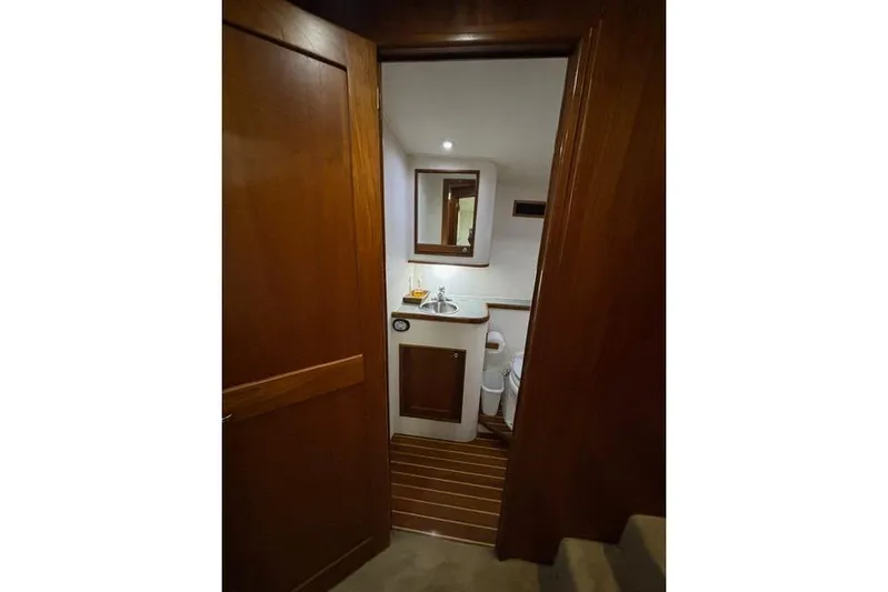 Sea Hag Yacht Photos Pics Luxurious bathroom interior of 2008 Blackwell Custom Carolina 61 yacht, featuring wood accents.