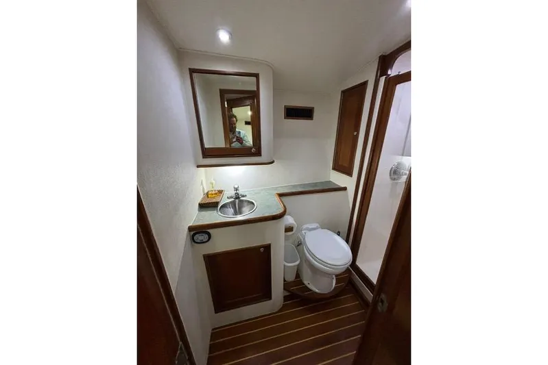Sea Hag Yacht Photos Pics Bathroom interior of 2008 Blackwell Custom Carolina 61 yacht, featuring sink and toilet.