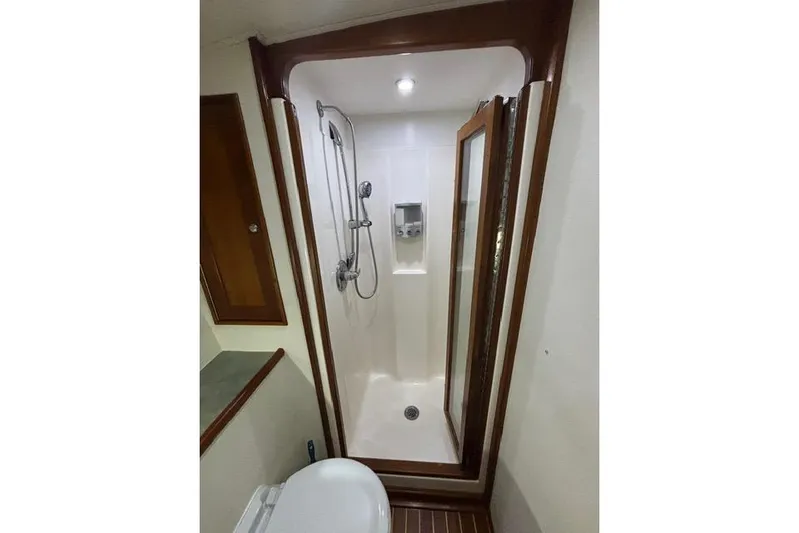 Sea Hag Yacht Photos Pics Shower area in 2008 Blackwell Custom Carolina 61 yacht, featuring modern fixtures and wooden accents.