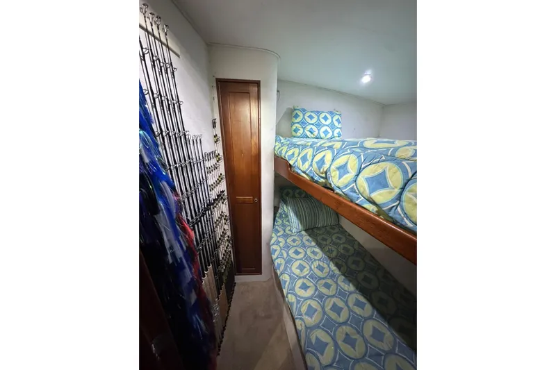 Sea Hag Yacht Photos Pics Interior of 2008 Blackwell Custom Carolina boat with bunk beds and fishing rods.