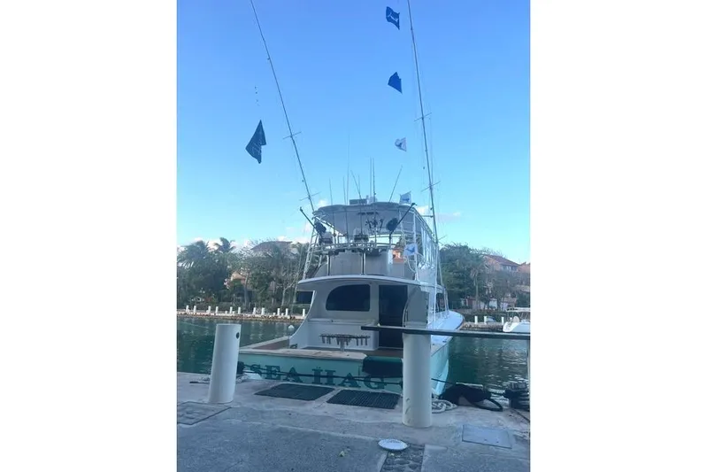 Sea Hag Yacht Photos Pics 2008 Blackwell Custom Carolina 61 yacht docked with fishing flags displayed.