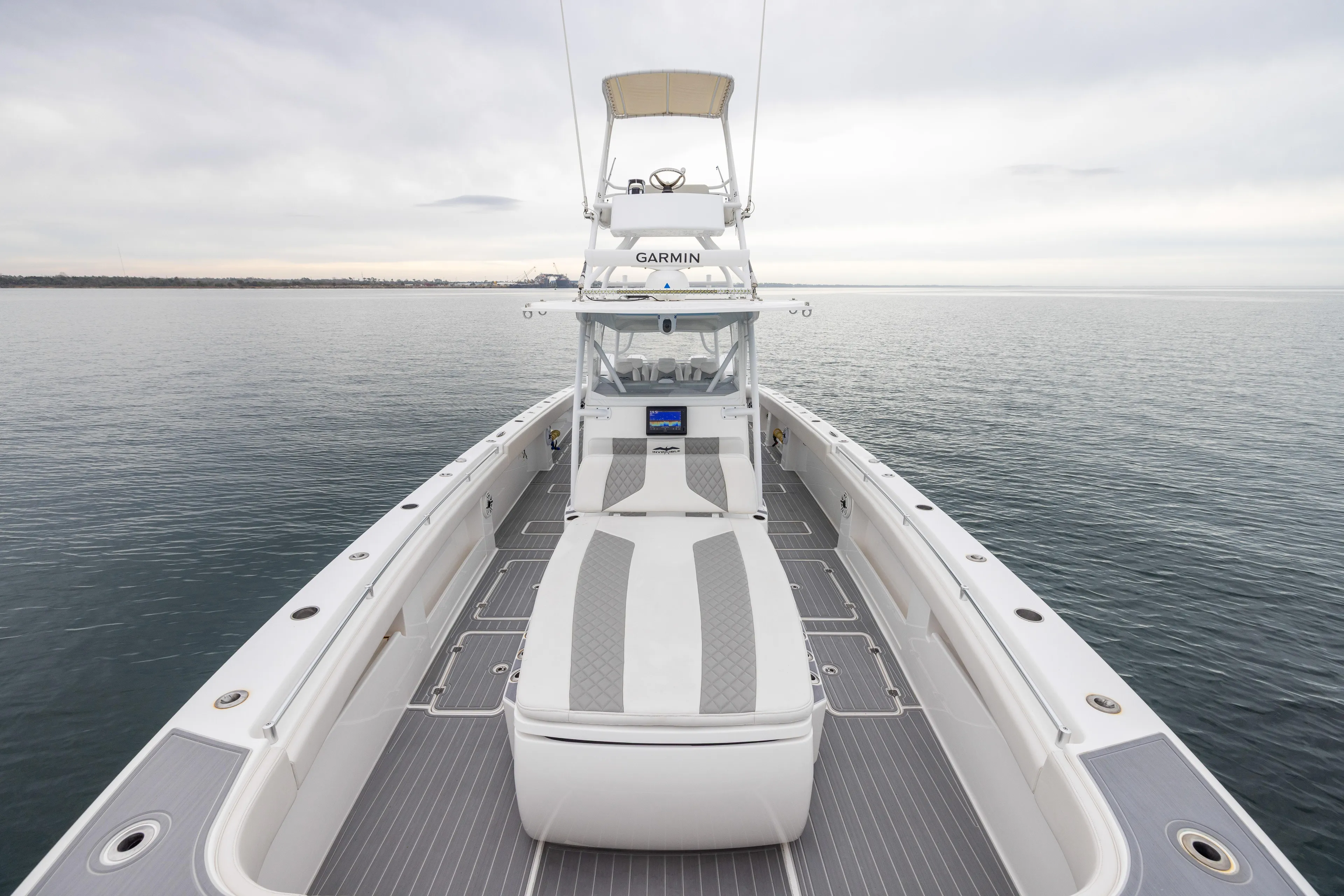  Yacht Photos Pics 2020 Invincible 40 Catamaran on calm water, showcasing spacious deck and modern design.