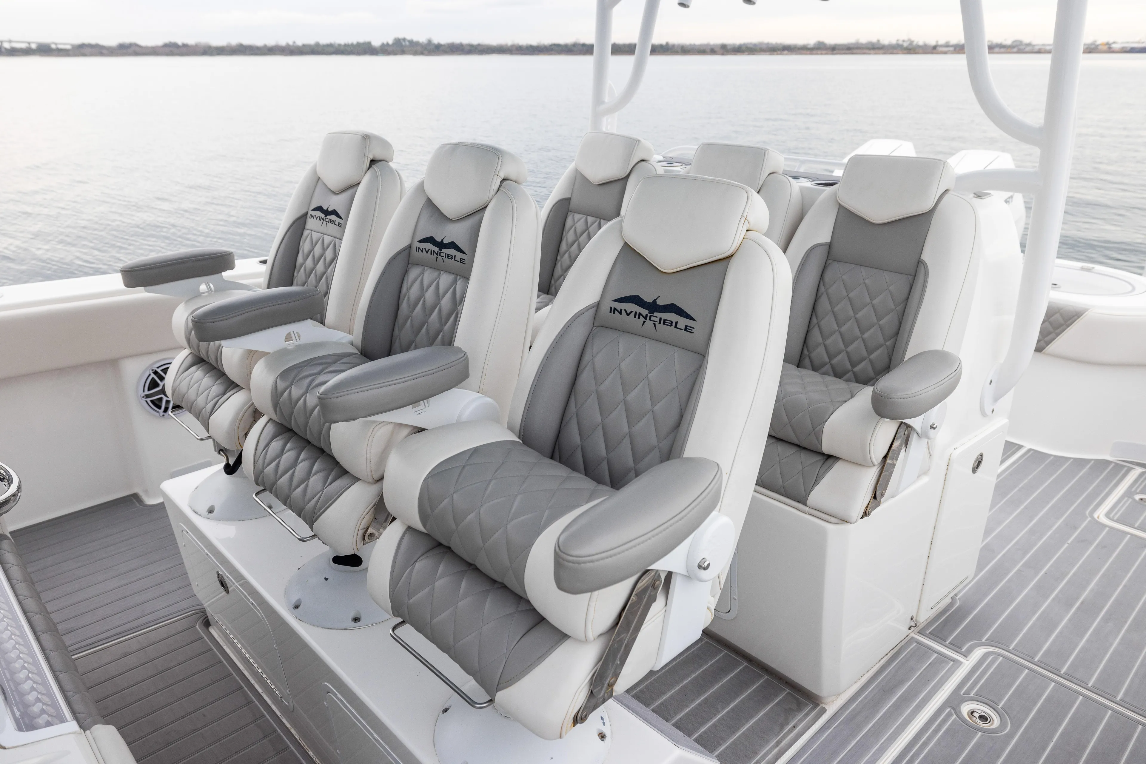  Yacht Photos Pics Luxurious seating on 2020 Invincible 40 Catamaran, featuring quilted gray and white upholstery.