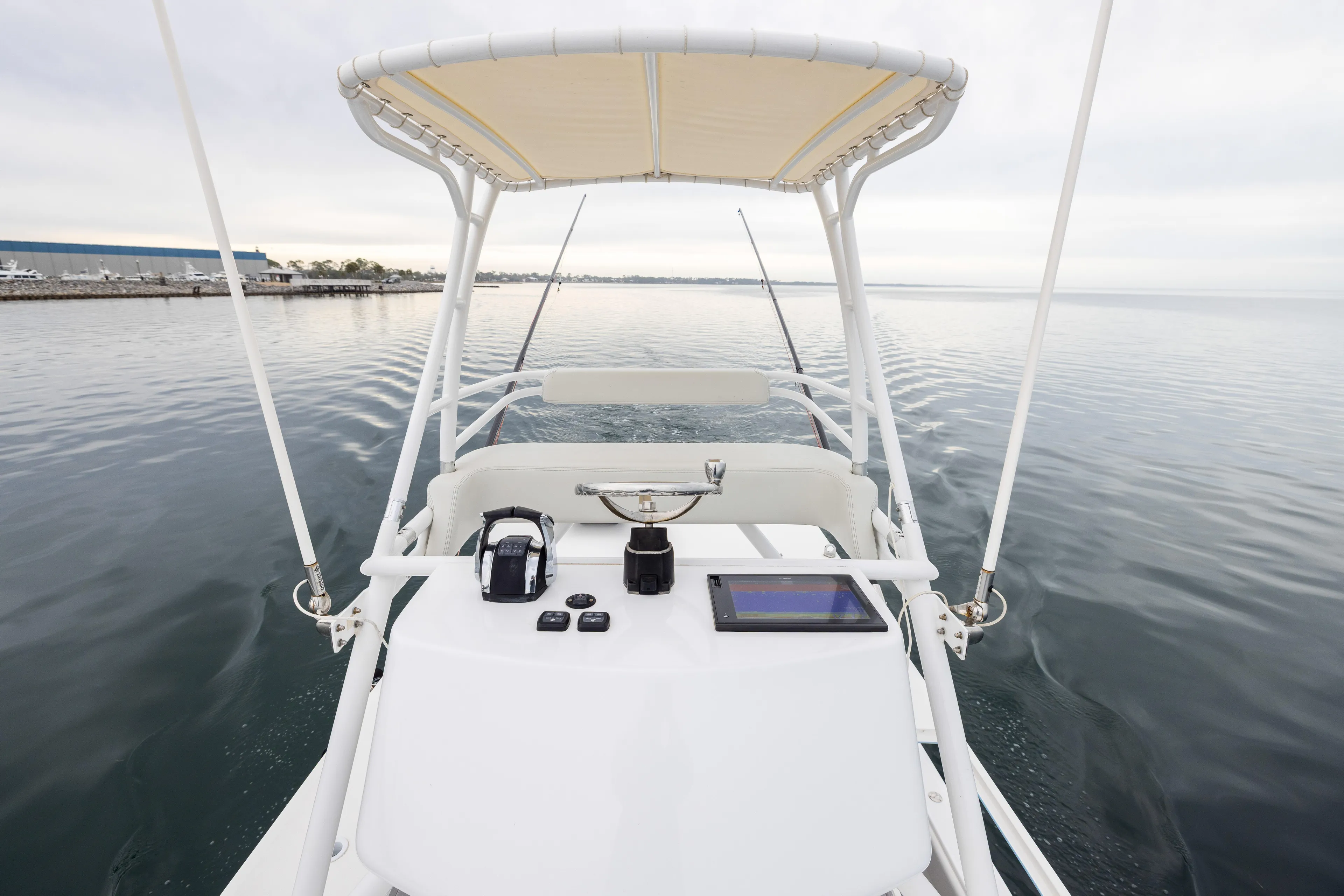  Yacht Photos Pics 2020 Invincible 40 Catamaran helm with navigation equipment on calm water.