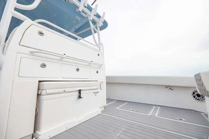  Yacht Photos Pics 2020 Invincible 40 Catamaran deck with storage compartments and seating area.