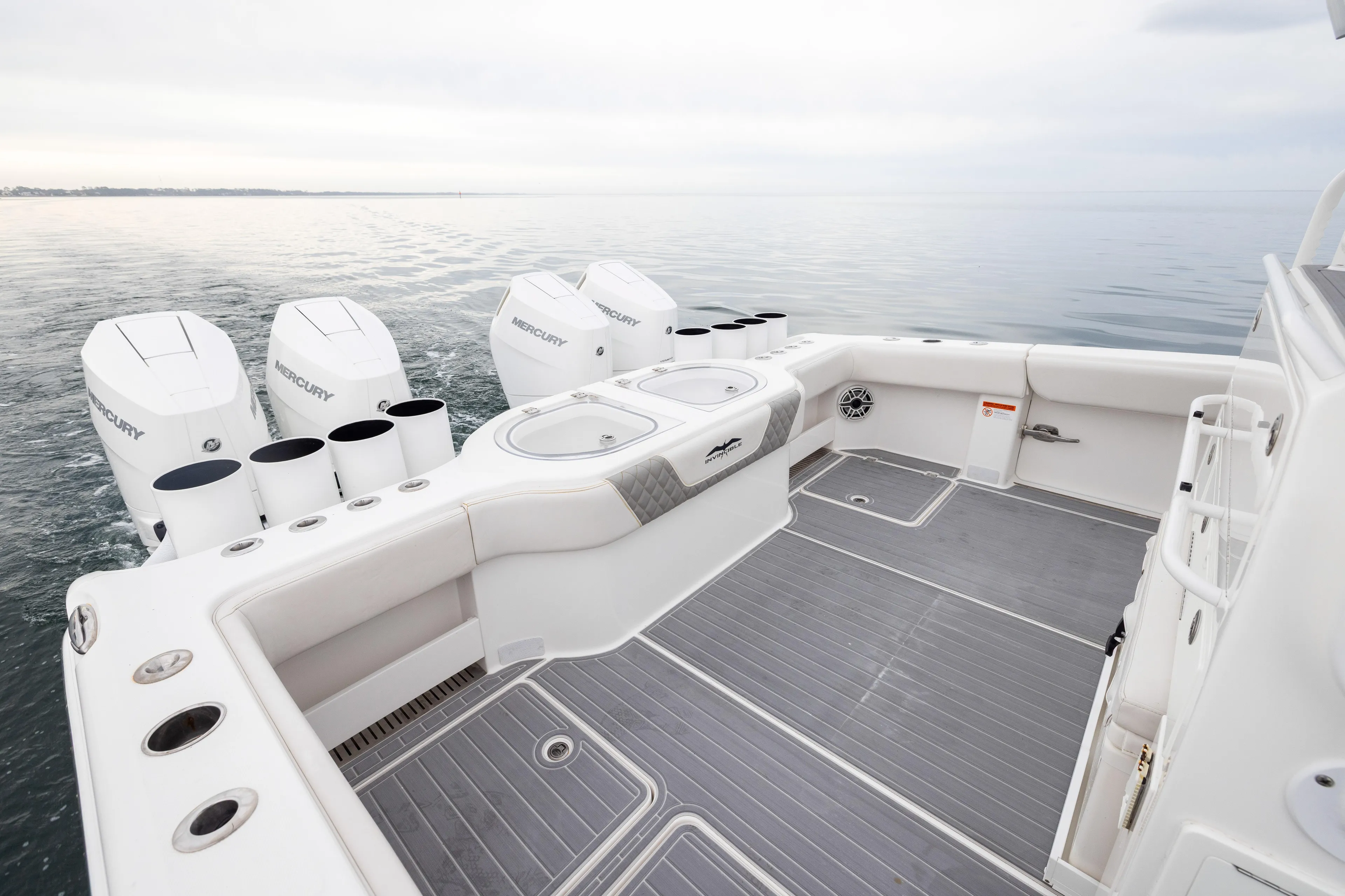  Yacht Photos Pics 2020 Invincible 40 Catamaran with Mercury engines on calm water.