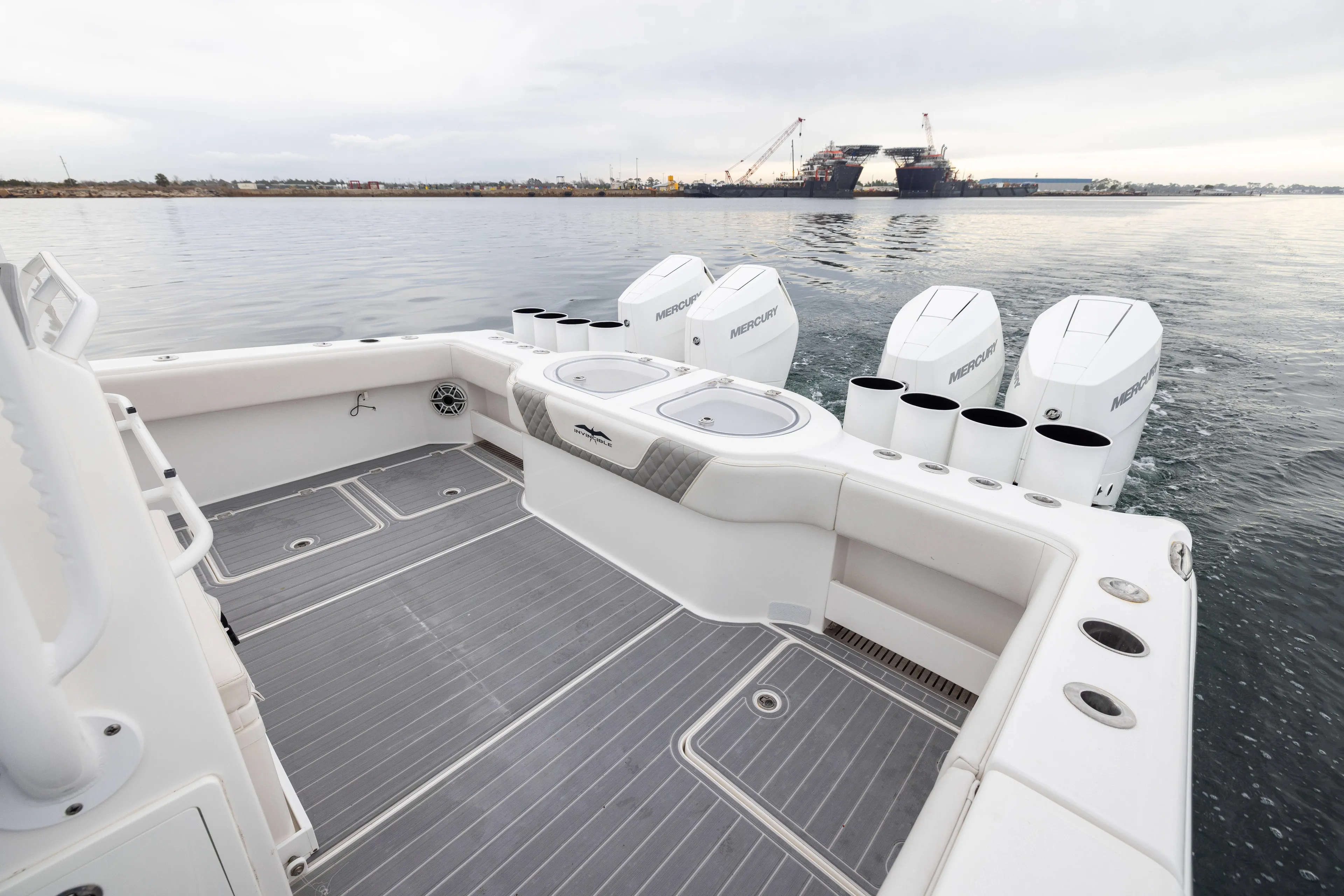  Yacht Photos Pics 2020 Invincible 40 Catamaran with Mercury engines, spacious deck, and ocean view.