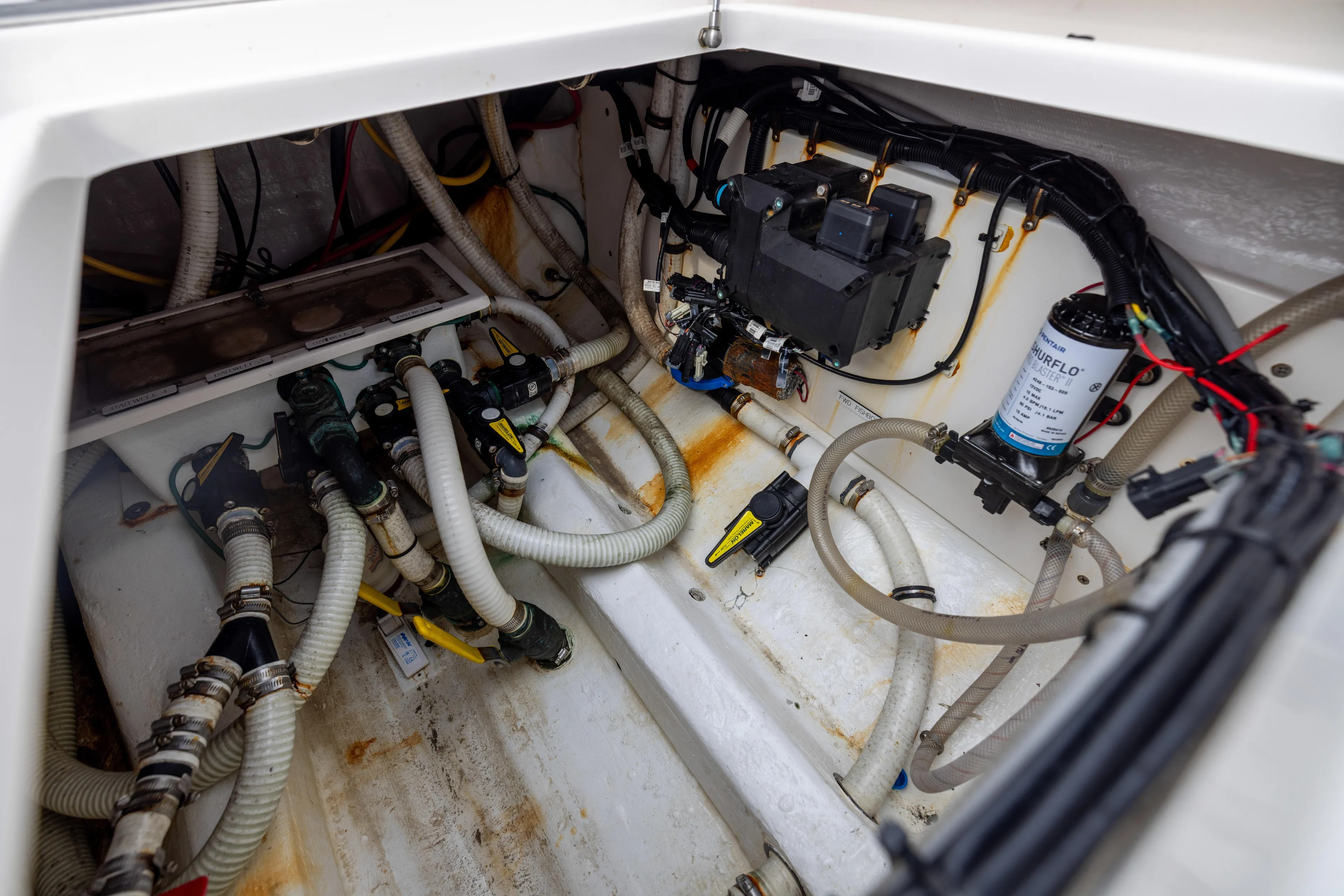  Yacht Photos Pics Engine compartment of 2020 Invincible 40 Catamaran with hoses and mechanical components.