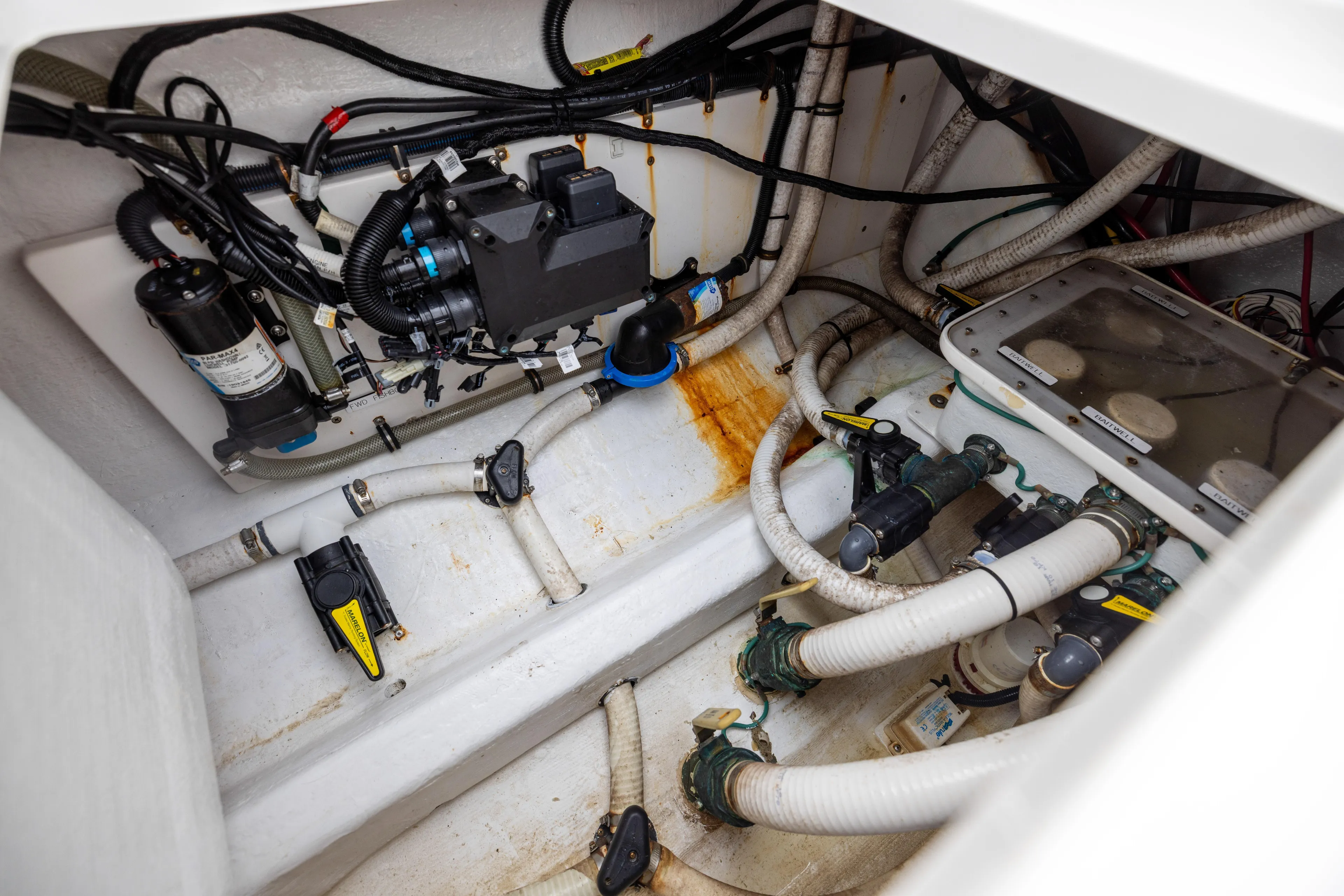  Yacht Photos Pics Engine compartment of 2020 Invincible 40 Catamaran with visible wiring and plumbing.