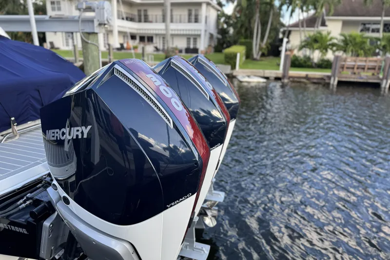  Yacht Photos Pics 2021 Formula 330 Crossover Bowrider OB with Mercury outboard engines by the water.