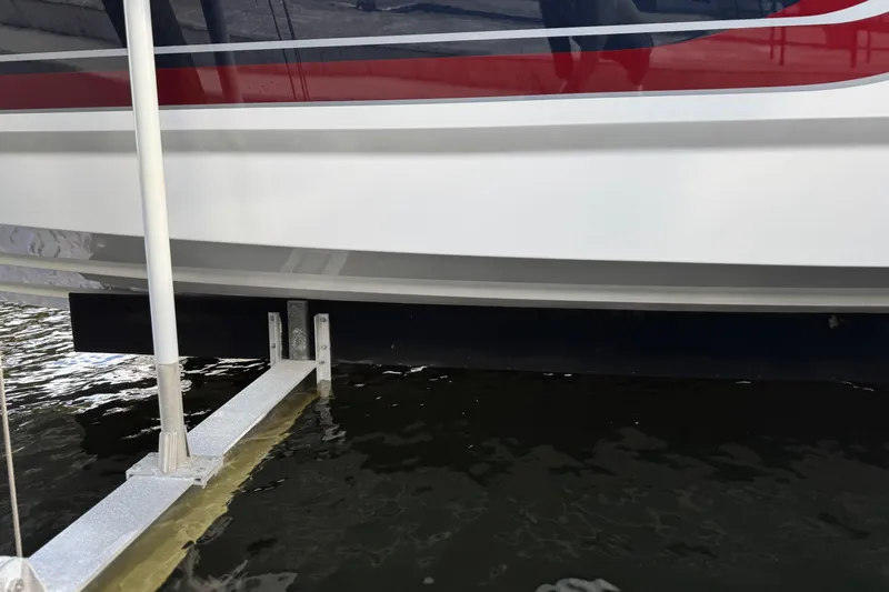  Yacht Photos Pics 2021 Formula 330 Crossover Bowrider OB hull above water at dock.