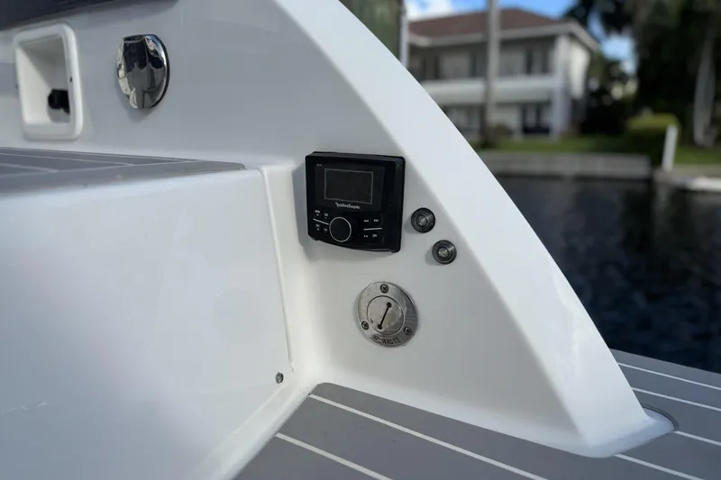  Yacht Photos Pics 2021 Formula 330 Crossover Bowrider OB boat control panel and waste outlet.