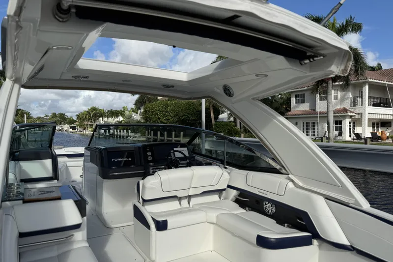  Yacht Photos Pics 2021 Formula 330 Crossover Bowrider OB interior with luxurious seating and open roof design.