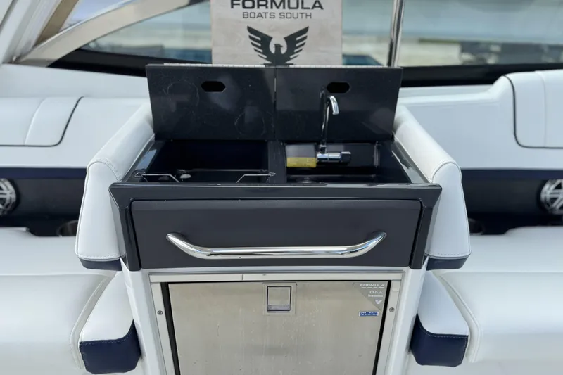  Yacht Photos Pics 2021 Formula 330 Crossover Bowrider OB boat interior with sink and storage.