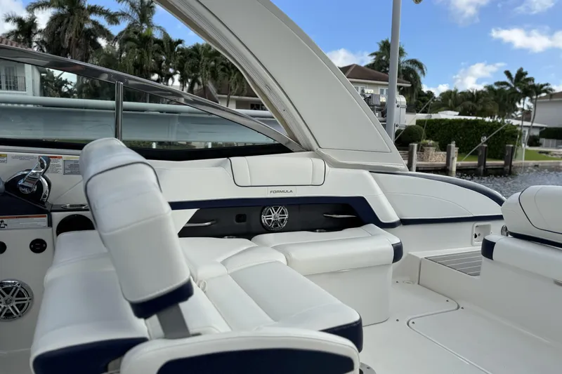  Yacht Photos Pics 2021 Formula 330 Crossover Bowrider OB interior with white seating and sleek design.