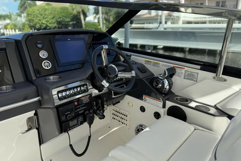  Yacht Photos Pics 2021 Formula 330 Crossover Bowrider OB cockpit with modern controls and navigation system.