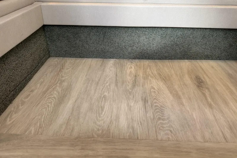  Yacht Photos Pics Interior flooring of 2021 Formula 330 Crossover Bowrider OB, featuring wood-like finish.